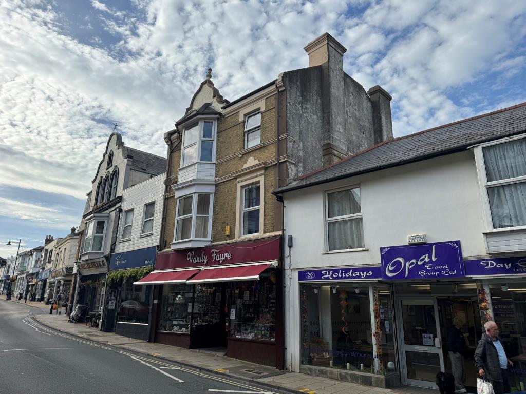 Lot: 94 - DOUBLE-FRONTED HIGH STREET SHOP WITH LARGE REAR STORES WITH POTENTIAL AND FREEHOLD INTEREST IN TWO FLATS OVER - Alternative from the street